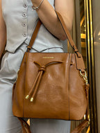 Bolsa Mão Pavão de Ouro